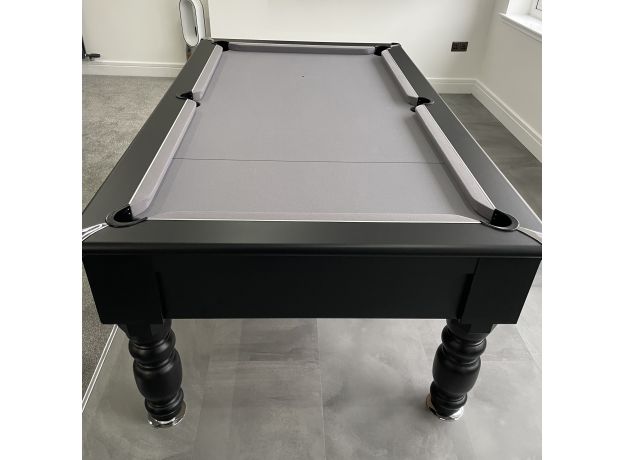 Black Optima Rennes pool table with gray felt and turned wooden legs.