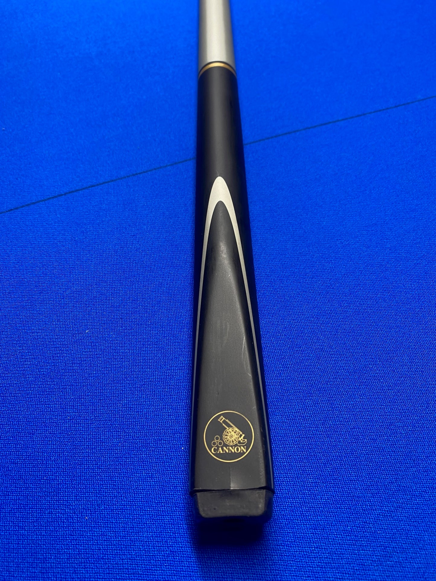Cannon Scorpion 3 Piece 57-inch cue butt with logo on a blue table.