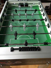 Load image into Gallery viewer, Top view of Roberto Sport football table with black and white players on a green playfield.