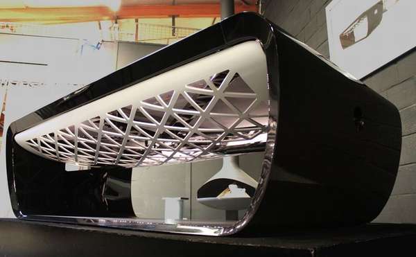 Blacklight designer pool table with black frame and intricate lattice design.