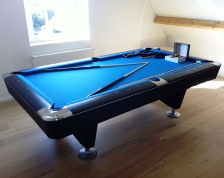 Buffalo Dominator 9' American pool table in a home setting with blue felt and accessories.