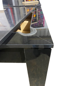 Close-up of the Rosetta pool dining table's pocket and gloss black finish.