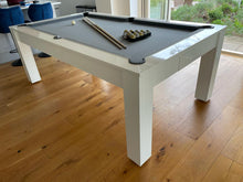 Load image into Gallery viewer, Gloss white pool dining table with black cloth in a modern dining room.