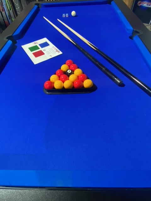 Close-up of Superpool Black Pearl pool table with blue felt and accessories.