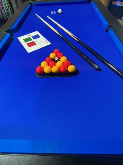 Close-up of Superpool Black Pearl pool table with blue felt and accessories.