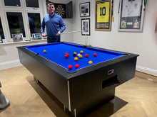 Load image into Gallery viewer, Superpool Black Pearl pool table with blue felt in a game room setting.