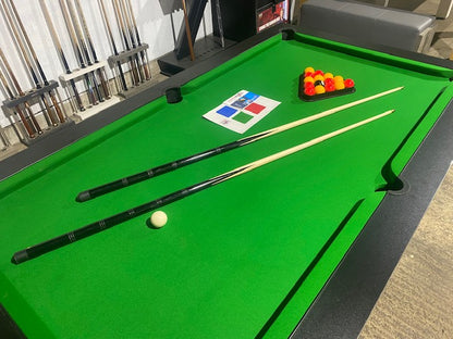 Superpool Black Pearl pool table with green felt and match play accessories.