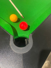 Load image into Gallery viewer, Close-up of Superpool Black Pearl pool table pocket with green felt and balls.