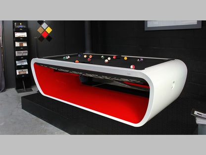 Blacklight designer pool table with white frame and red interior finish.