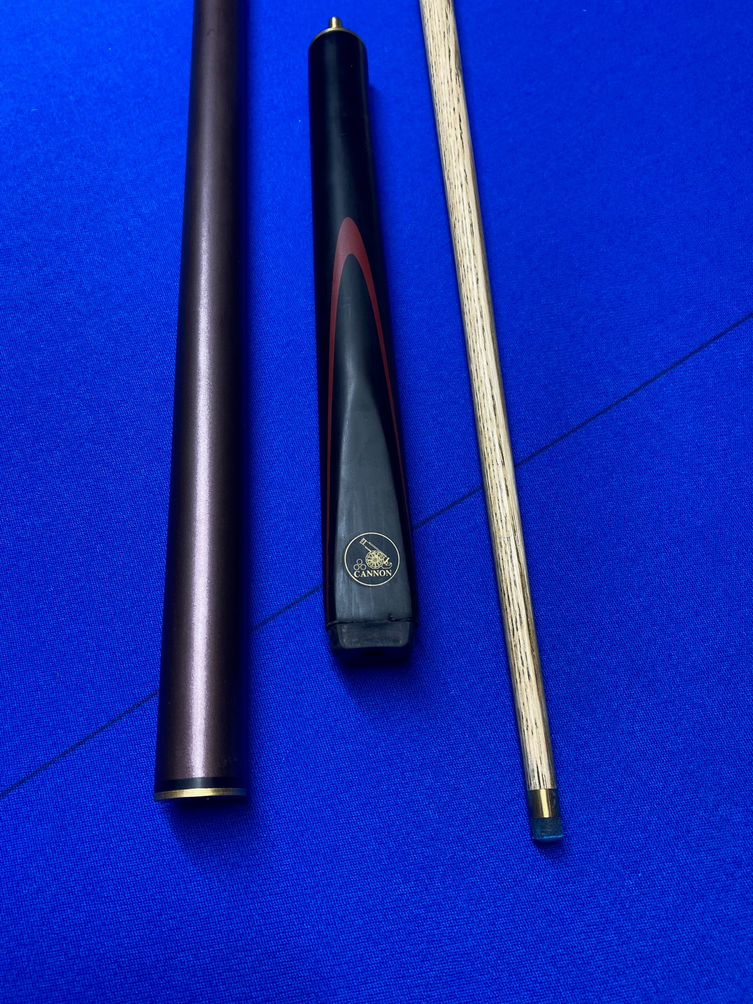 Cannon Viper 3 Piece 57-inch cue components displayed on blue surface.