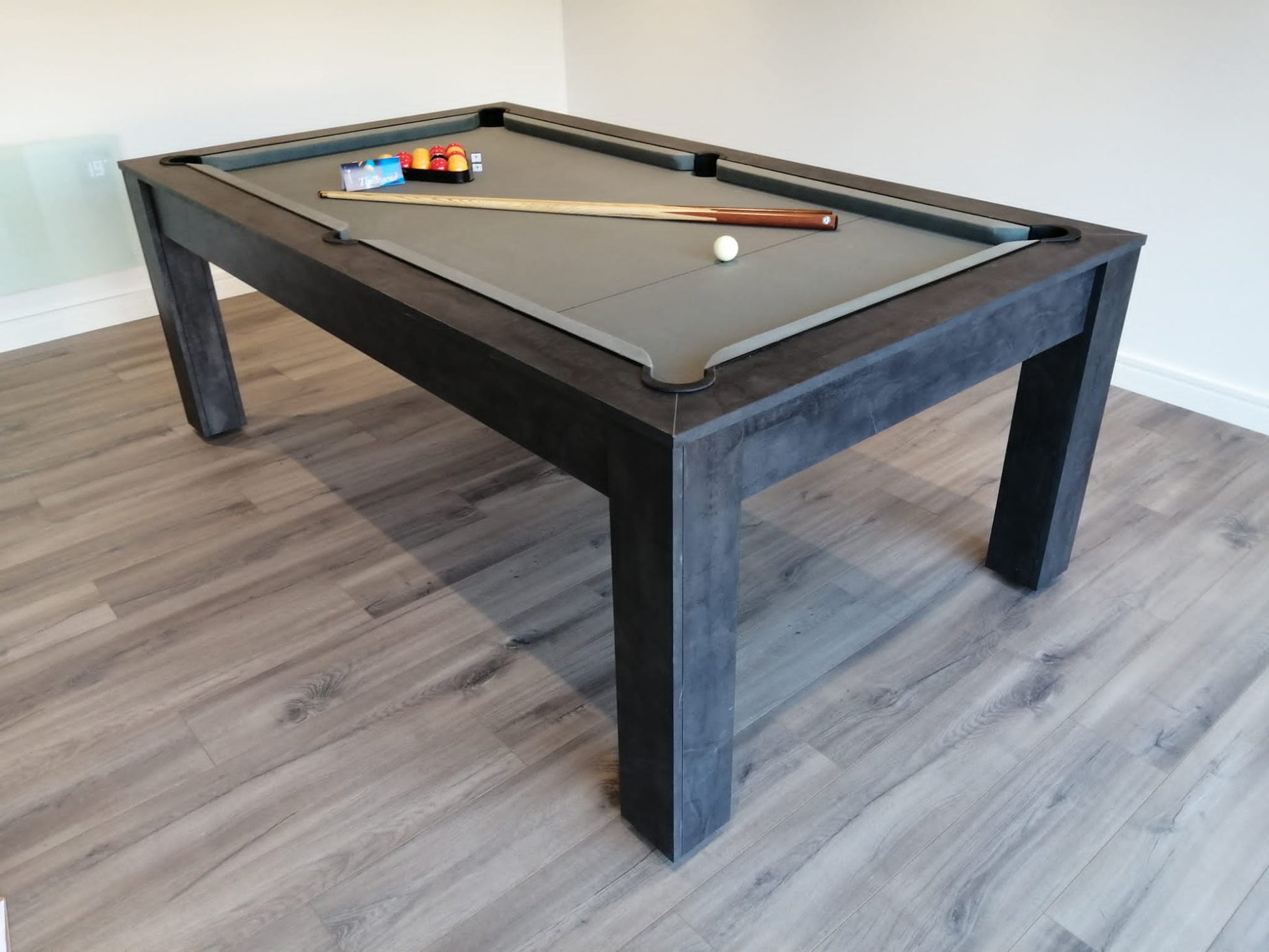 Sleek Rosetta pool dining table with gray felt and dark wood finish.