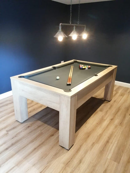 Nebraska Oak pool table with green felt in a modern room with wood flooring.