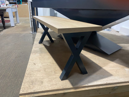 Angled view of the cross leg pool dining table bench highlighting its sturdy frame.