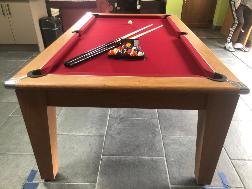 Supreme Oak Classic Diner pool table with red felt in a tiled room.