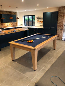 Supreme Oak Classic Diner pool table with blue felt in a modern kitchen.