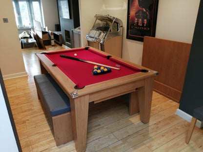 Supreme Oak Classic Diner pool table with red felt and bench seating in a cozy room.