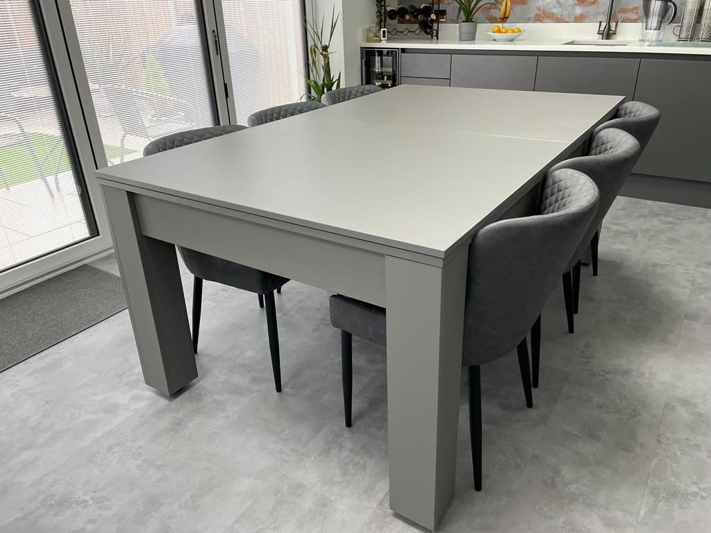 Satin Grey Rosetta pool dining table set up as a dining table with chairs.