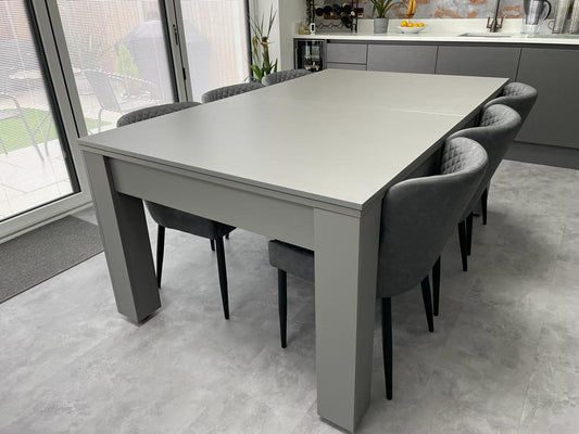Satin Grey Rosetta pool dining table set up as a dining table with chairs.