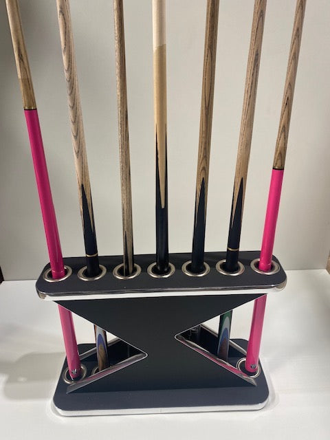 Black Lightning Cue Stand by Superpool with pink and black cues displayed.