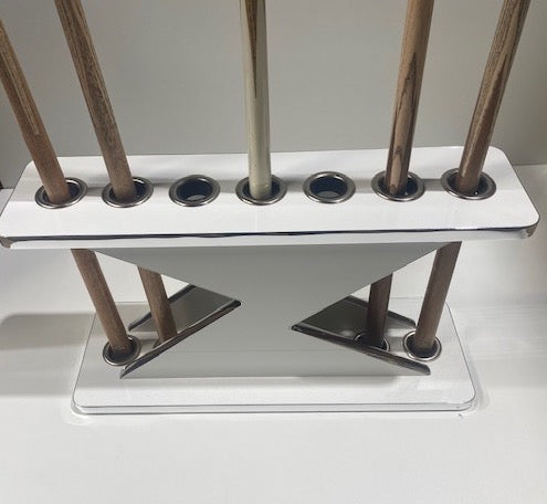 White Lightning Cue Stand by Superpool with wooden cues displayed.